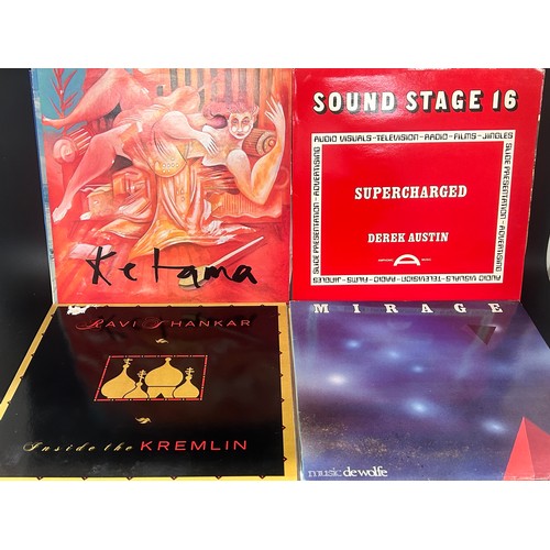 2135 - Approximately 75 pop and rock LP records, also a vintage case, Paul McCartney, UB40, etc.