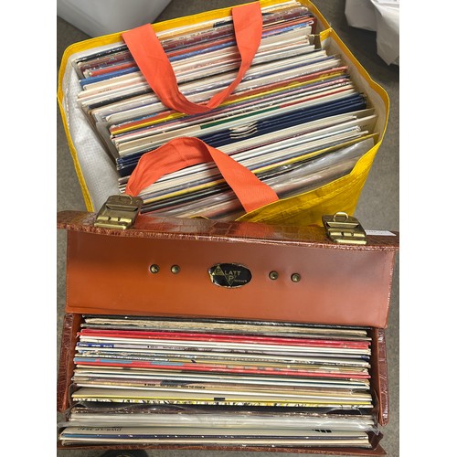 2135 - Approximately 75 pop and rock LP records, also a vintage case, Paul McCartney, UB40, etc.
