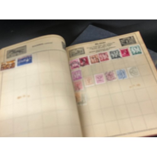 2170 - A collection of 20th Century British and foreign stamps in albums and a collection of cigarette card... 