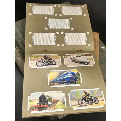 2170 - A collection of 20th Century British and foreign stamps in albums and a collection of cigarette card... 