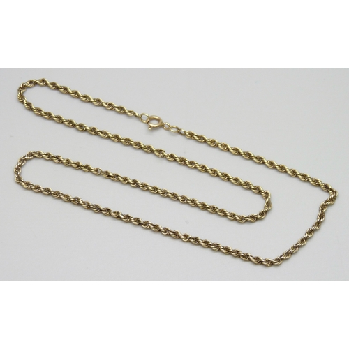 7002 - A yellow metal rope chain necklace, the clasp marked 14k, a couple of small twist links missing, 8.5... 