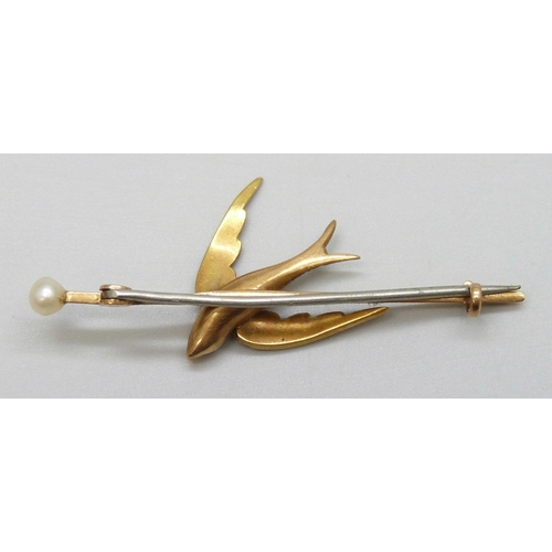 7003 - A Victorian yellow metal and seed pearl swallow brooch, 4.1g, 5.2cm