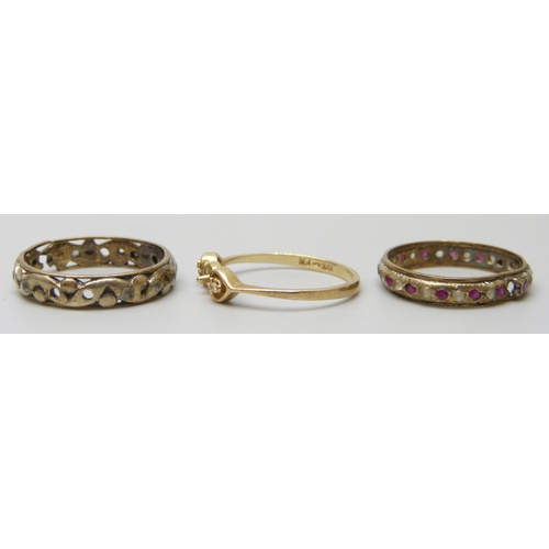 7008 - A 10k gold ring, 1.1g, a 9ct gold ring, 2.2g, and a yellow and white metal ring, 1.4g, all a/f