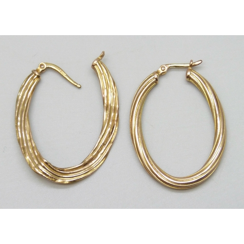 7009 - A pair of 9ct gold earrings, a/f, 2.1g