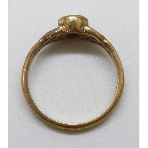 7023 - A 9ct gold Celtic design opal ring, 2.8g, N