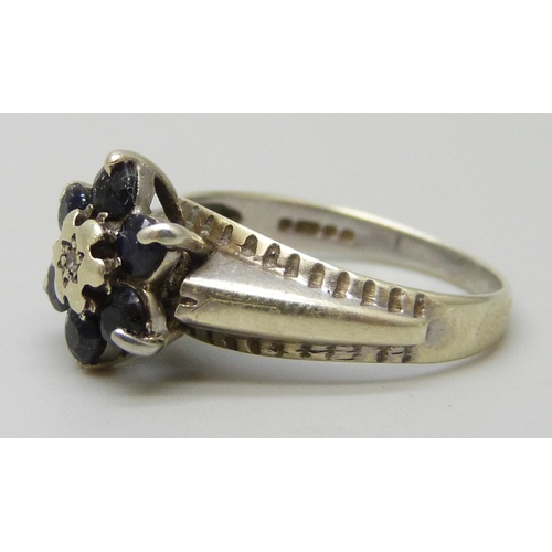 7027 - A 9ct gold white gold, sapphire and diamond ring, 2.7g, L