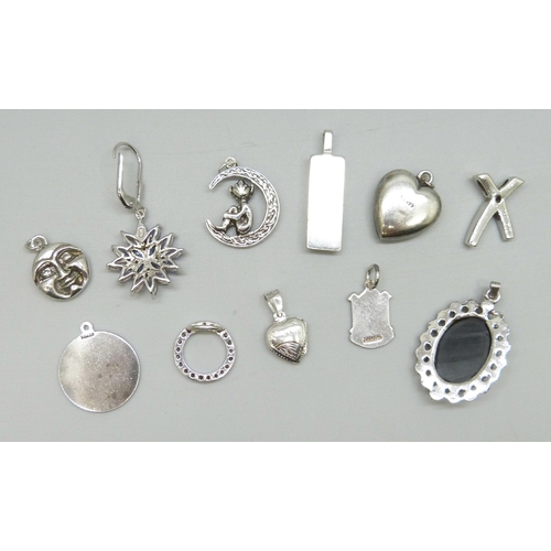 7029 - A single silver earring and a collection of silver and white metal pendants including an ingot penda... 