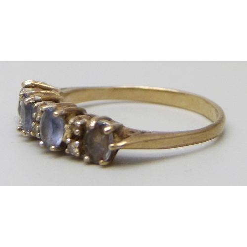 7039 - A 9ct gold and diamond ring set with blue stones, 1.5g, K/L