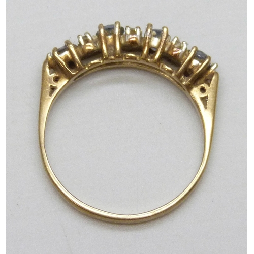 7039 - A 9ct gold and diamond ring set with blue stones, 1.5g, K/L