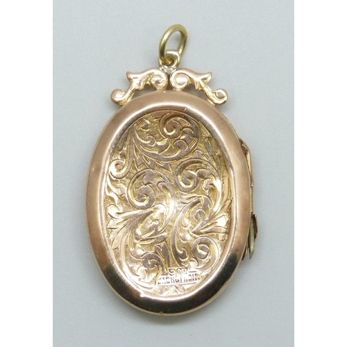 7042 - A 9ct gold back and front locket, a/f, 4.4g