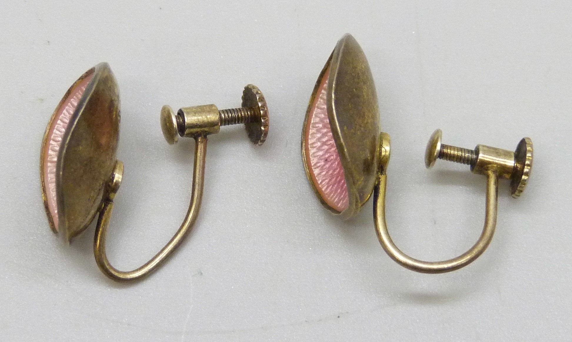 A pair of Ivar Holth Norwegian silver gilt and pink guilloche enamel ...