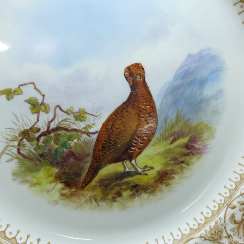2001 - Royal Worcester Vitreous plates with hand painted game bird detail, circa 1900, 23cm