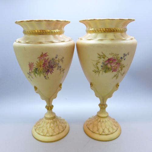 2007 - A pair of 2314 Royal Worcester Blush Ivory vases, 1906, (one a/f, chip on the rim), 20cm