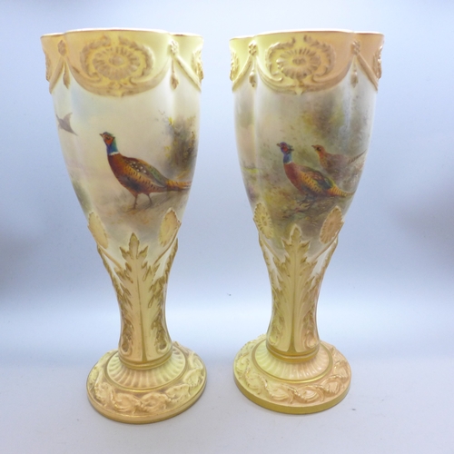 2008 - A matched pair of early 20th century hand decorated Royal Worcester chalice vases, signed Jas Stinto... 