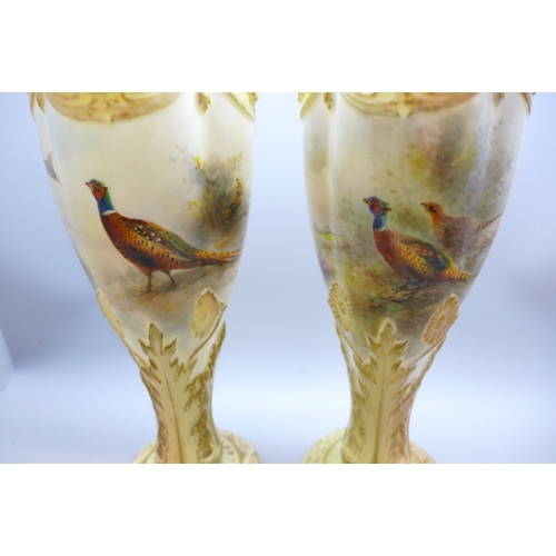 2008 - A matched pair of early 20th century hand decorated Royal Worcester chalice vases, signed Jas Stinto... 