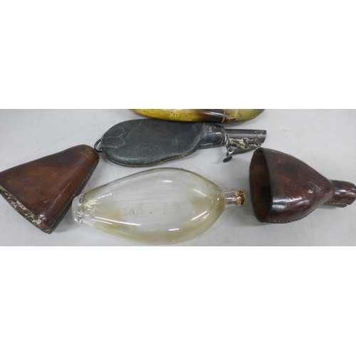 2022 - Four powder flasks, including leather and horn