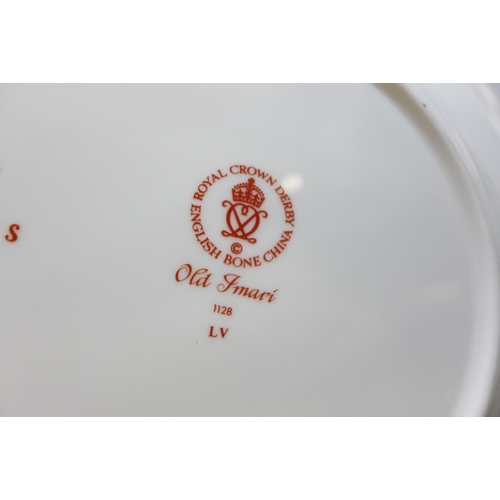 2037 - A pair of Royal Crown Derby 1128 Imari wavy edge plates, a similar plate, dish and saucer, and anoth... 