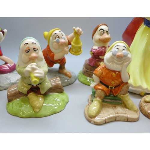 2040 - A Royal Doulton Snow White figure and six Seven Dwarfs figures, including Doc, Doc with Lantern, Bas... 