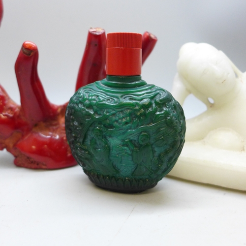 2041 - Four oriental snuff bottles, a carved alabaster figure and a coral piece