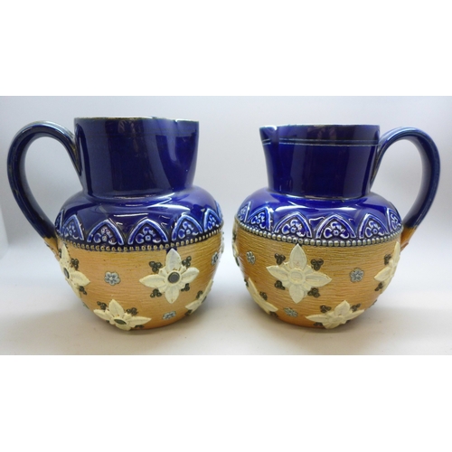 2048 - A pair of Royal Doulton stoneware jugs, stamped 1581, 13cm