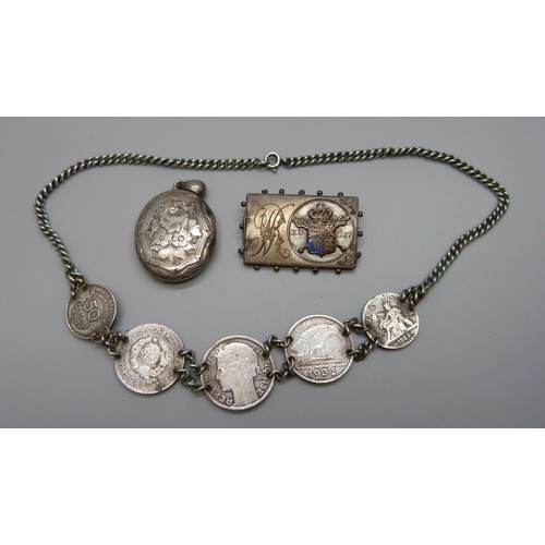 7065 - A white metal Victorian locket, a Victorian 1887 Golden Jubilee silver brooch and a white metal coin... 