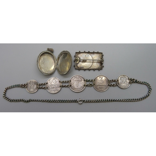 7065 - A white metal Victorian locket, a Victorian 1887 Golden Jubilee silver brooch and a white metal coin... 