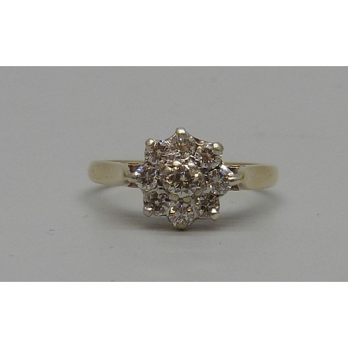 7066 - A 9ct gold diamond cluster ring, 2.4g, P