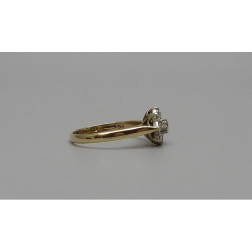 7066 - A 9ct gold diamond cluster ring, 2.4g, P