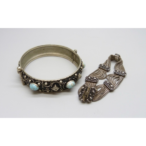 7078 - An Eastern silver bracelet, 26g, and a metal bangle
