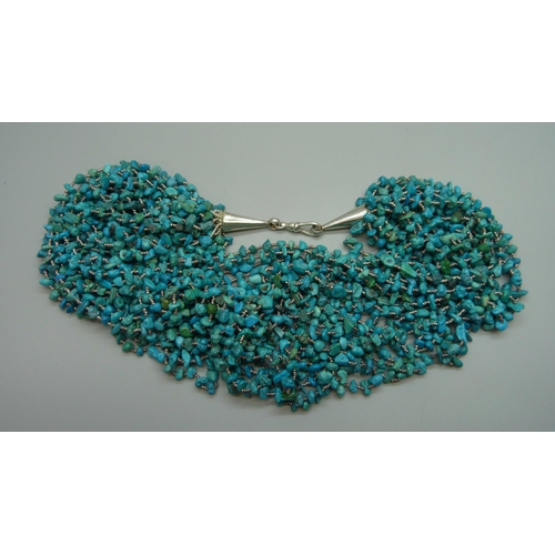 7080 - A statement large seventeen strand turquoise necklace with a silver clasp, 175g, shortest strand 47c... 