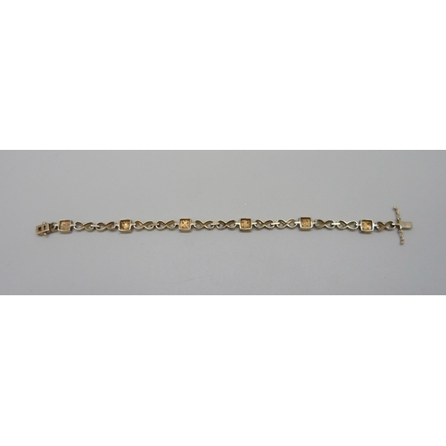 7088 - A 9ct gold and diamond bracelet, 10.7g, 18.3cm, boxed