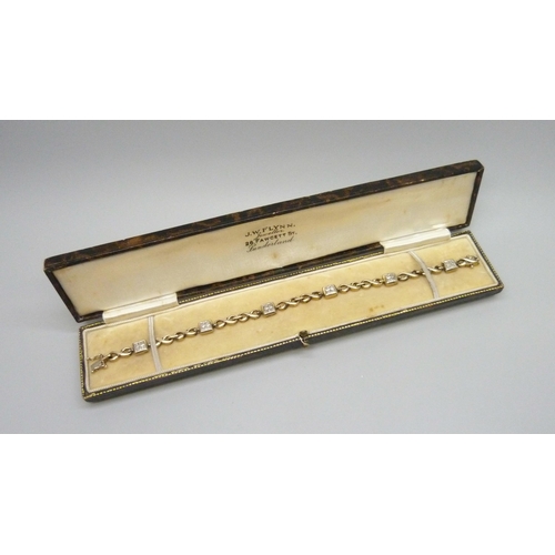 7088 - A 9ct gold and diamond bracelet, 10.7g, 18.3cm, boxed