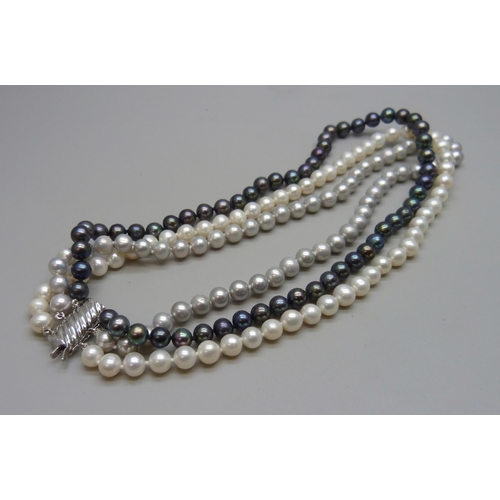 7090 - A three stand black, grey and white pearl choker necklace with a silver clasp, 60g, 38cm shortest st... 
