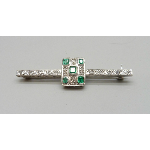 7106 - An Art Deco platinum set emerald and diamond brooch, 6.1g, 5cm, boxed