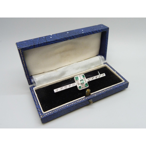 7106 - An Art Deco platinum set emerald and diamond brooch, 6.1g, 5cm, boxed