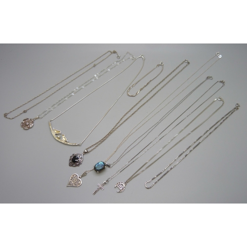 7113 - A collection of silver and white metal pendants with chains incluidng a Kit Heath pendant, 43g