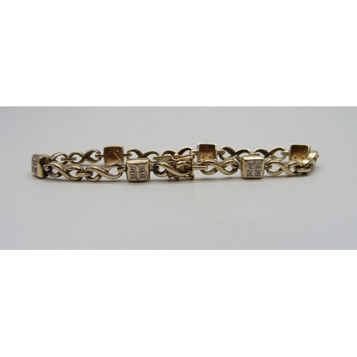7088 - A 9ct gold and diamond bracelet, 10.7g, 18.3cm, boxed