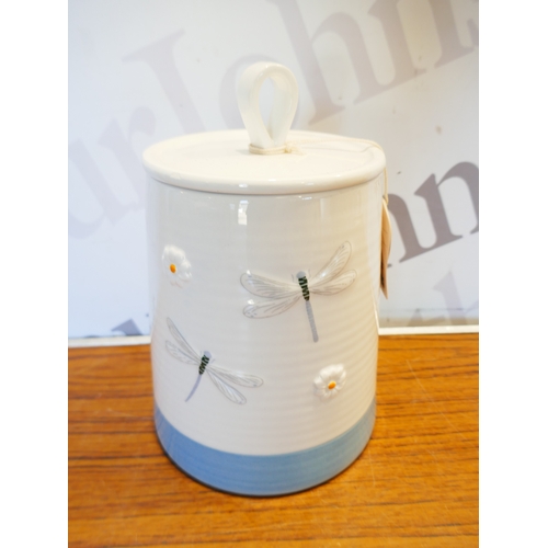 6028 - A box of miscellaneous items to include medical supports, biscuit barrell, assortment of plugs, etc.... 