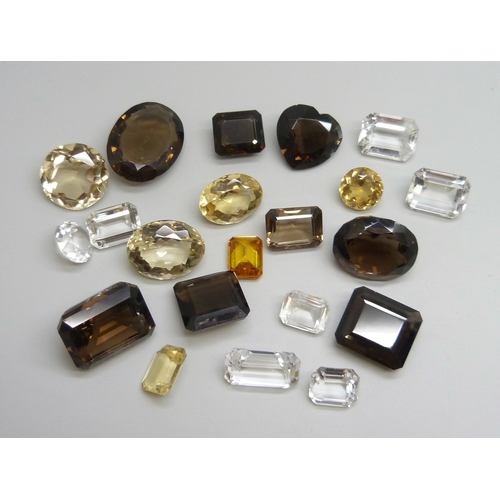 A collection of unmounted stones including citrine and smoky quartz ...
