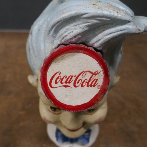5044 - A cast metal Coca Cola bank *This lot is subject to VAT
