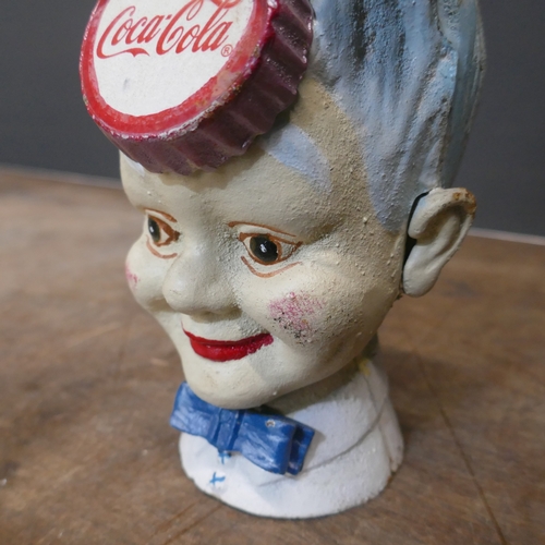 5044 - A cast metal Coca Cola bank *This lot is subject to VAT