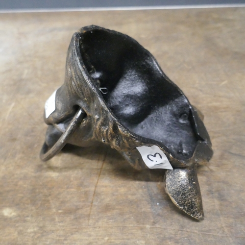 5046 - A cast metal boars head with a metal ring *This lot is subject to VAT