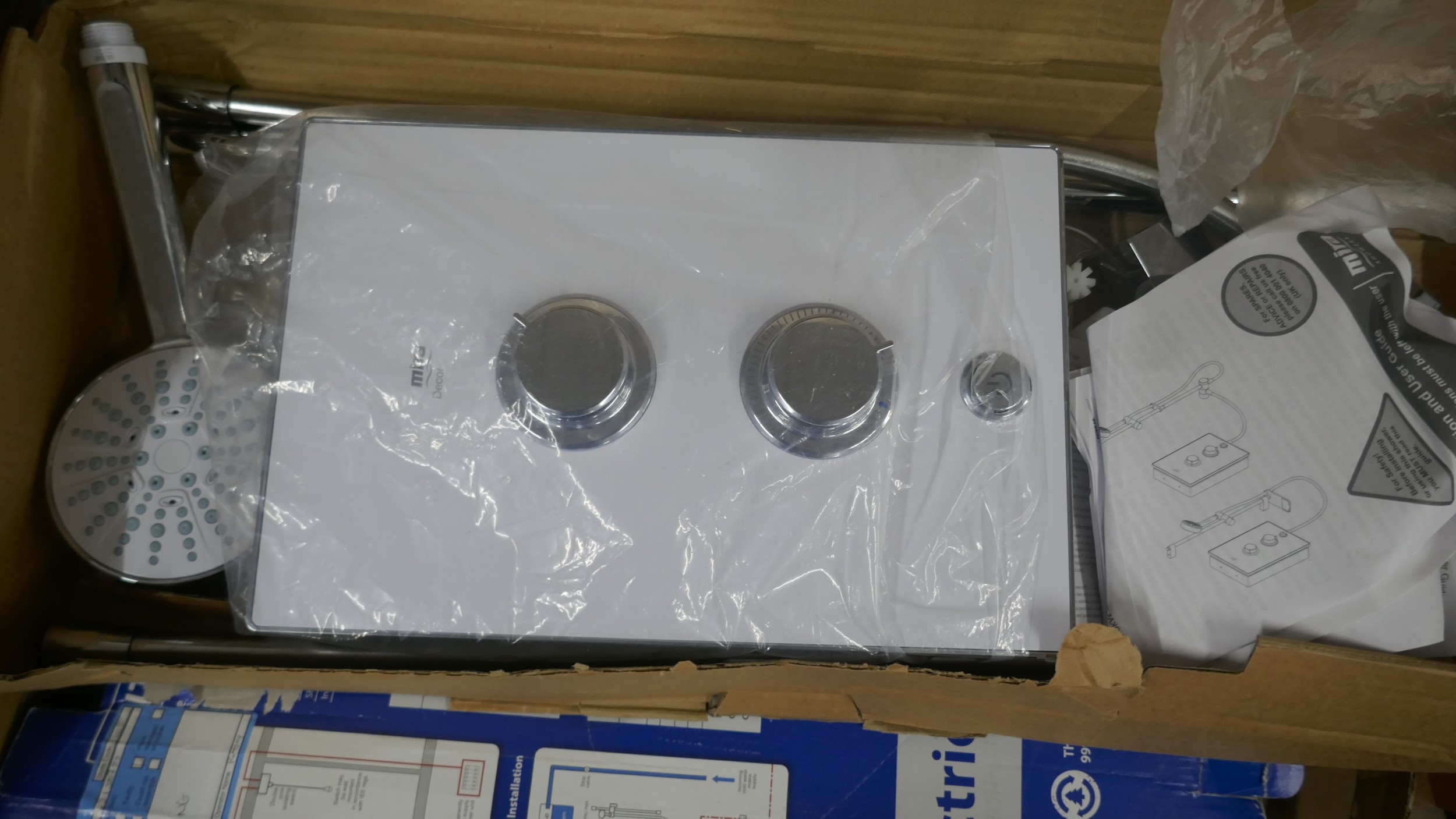 A large quantity of assorted electric shower units and other shower ...