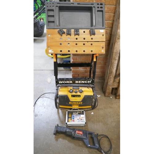 A Workmate modified with a tray, a DeWalt 240V site radio a Rotacraft ...