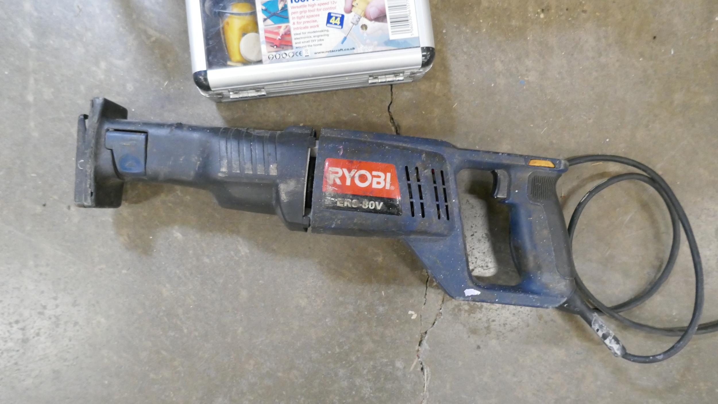 A Workmate modified with a tray, a DeWalt 240V site radio a Rotacraft ...