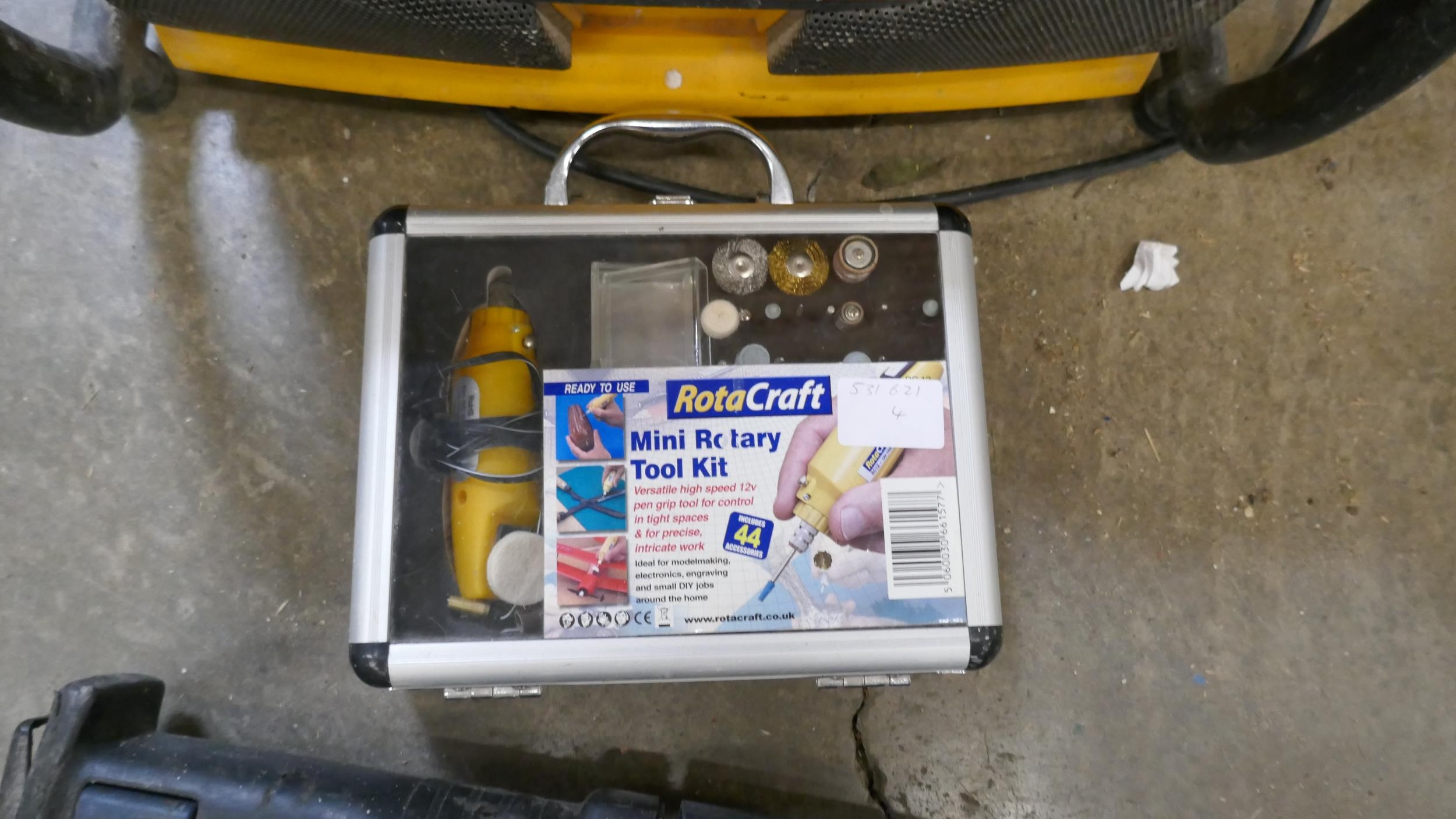 A Workmate modified with a tray, a DeWalt 240V site radio a Rotacraft ...