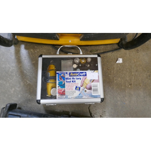 A Workmate modified with a tray, a DeWalt 240V site radio a Rotacraft ...