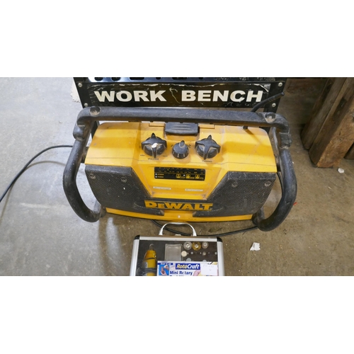 A Workmate modified with a tray, a DeWalt 240V site radio a Rotacraft ...