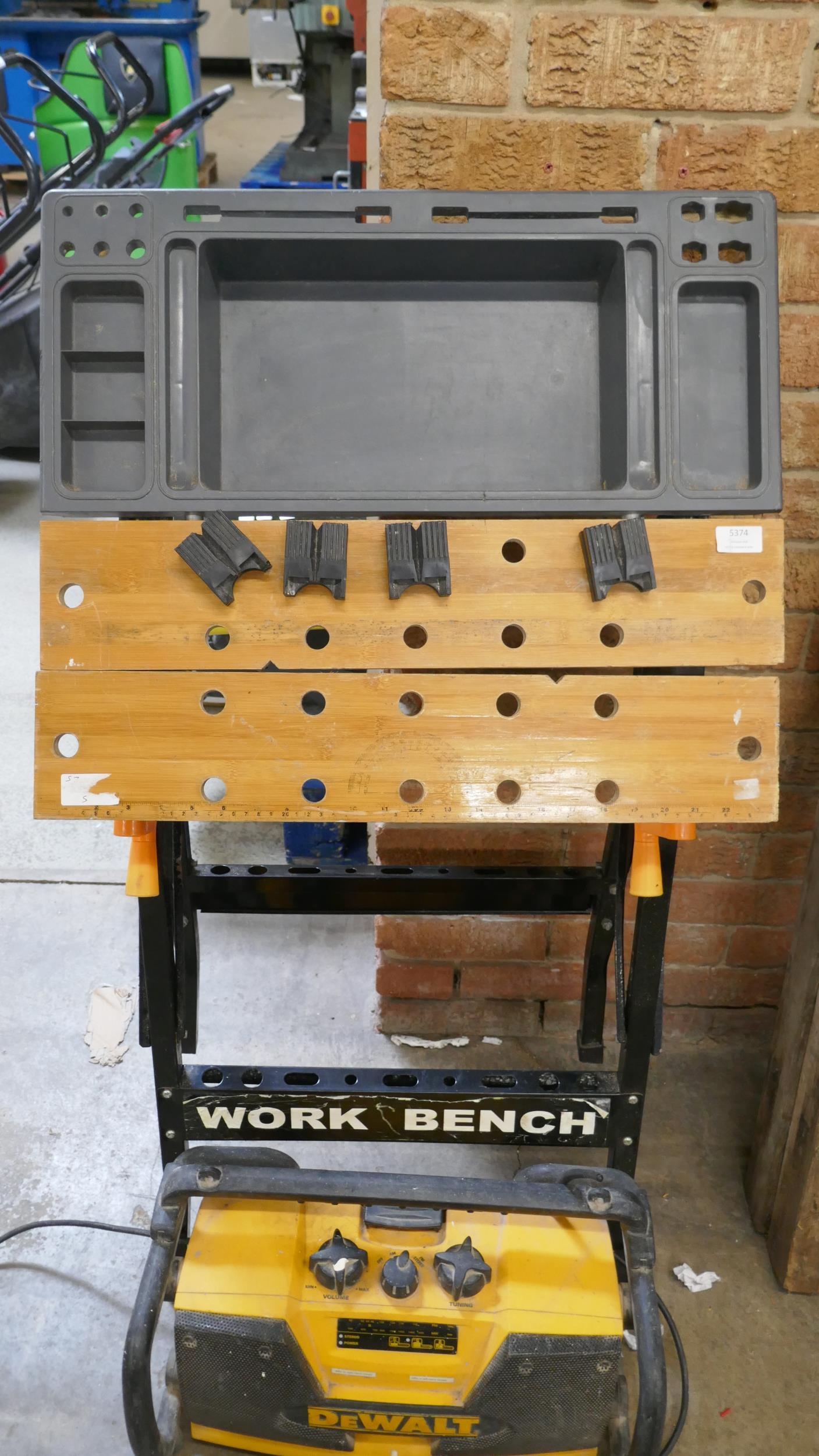 A Workmate modified with a tray, a DeWalt 240V site radio a Rotacraft ...