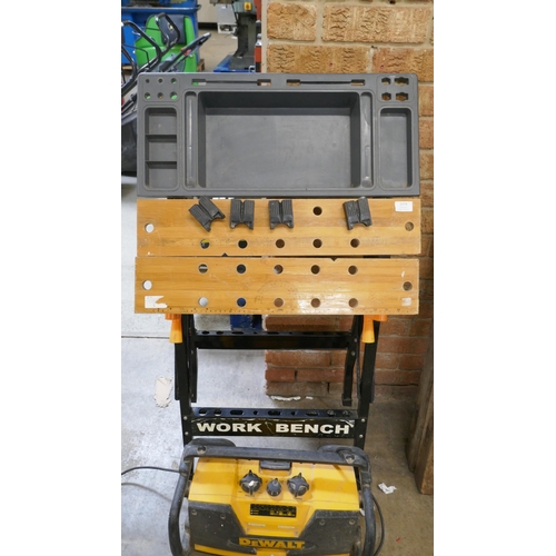 A Workmate modified with a tray, a DeWalt 240V site radio a Rotacraft ...